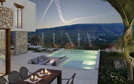 Villa de lujo estilo ibicenco con piscina infinita y vistas panorámicas en Jávea